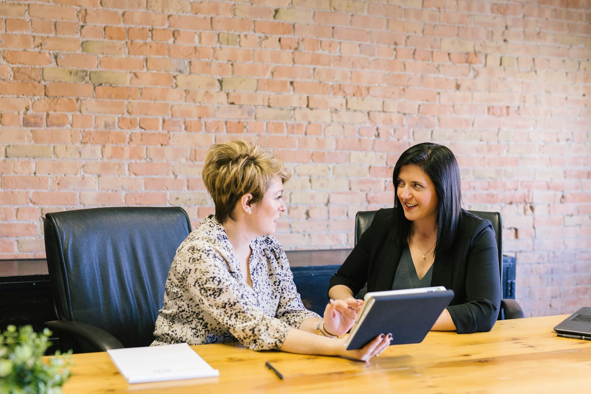 Two professionals in conversation during a consulting session
